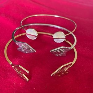 Lot of 3. 2 Arrow cuff bracelets. One silver and the other gold.